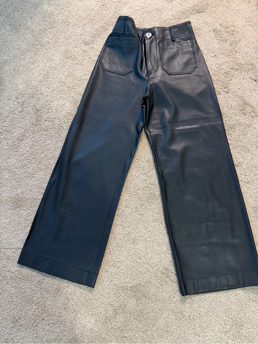 Anthropologie’s Maeve Colette pant in black faux leather size 25